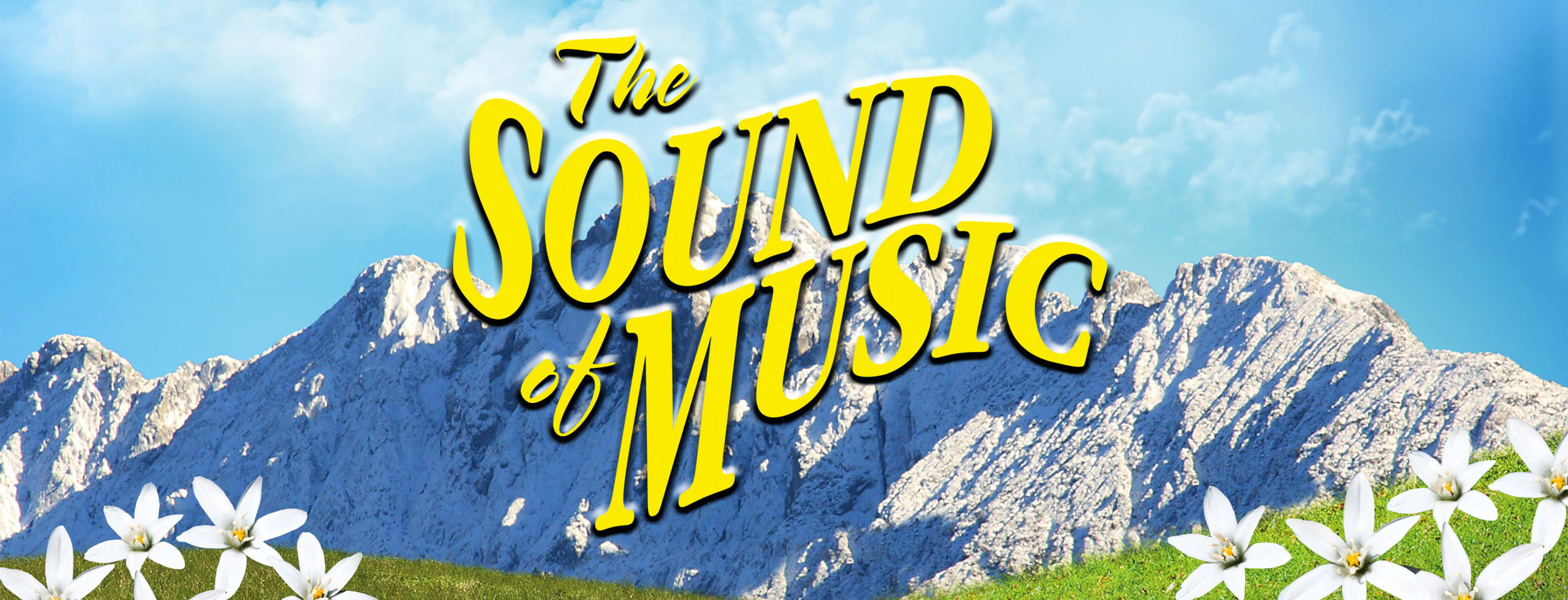 "The Sound of Music" Logo hangs in front of the Austrian mountains.